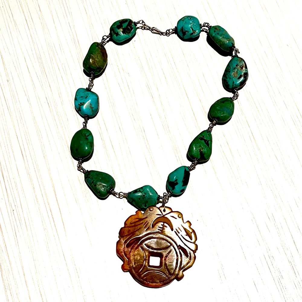 Turquoise necklace with asian inspired pendant